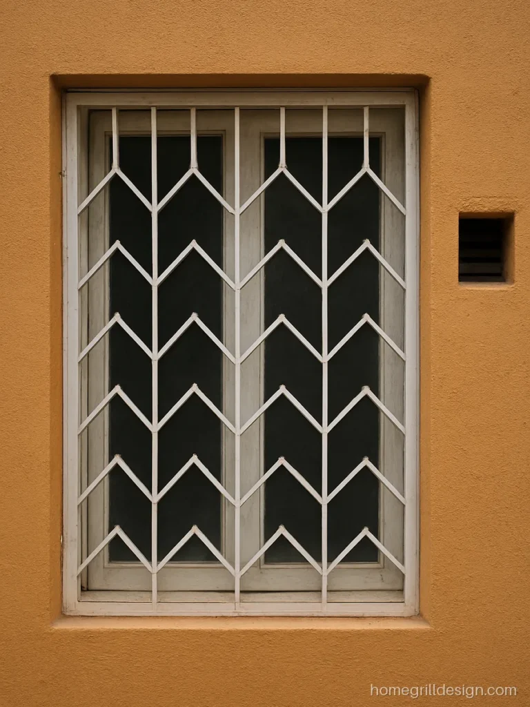 MS window grill design with zigzag flat strips in white on a kitchen window